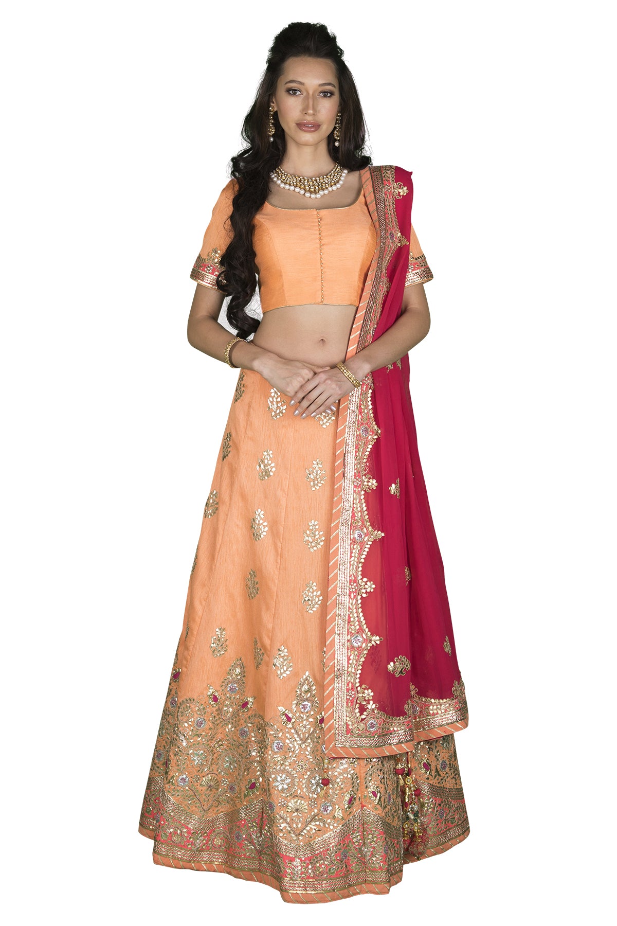 Look pretty in peach in our silk top & peach gota embroidered lehenga set to your next family wedding. The hot pink georgette embroidered dupatta brings an added oomph to this outfit.